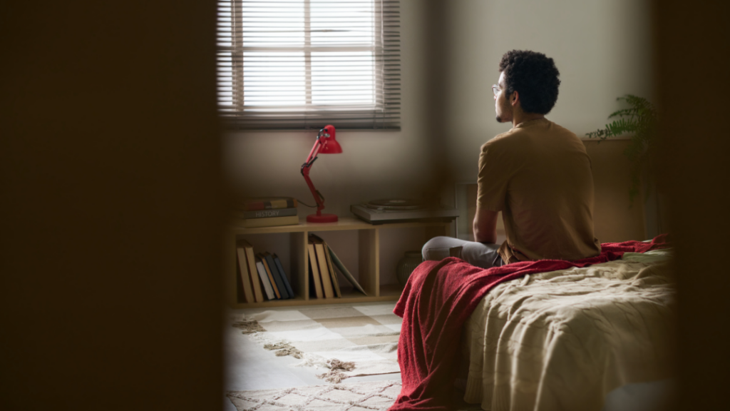 Teen spending a lot of time in their room alone, illustrating what's normal teenage behavior and how parents can support them.